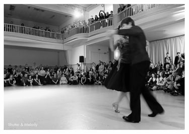 A couple dancing to a crowd at Ballhaus Rixdorf in Berlin.