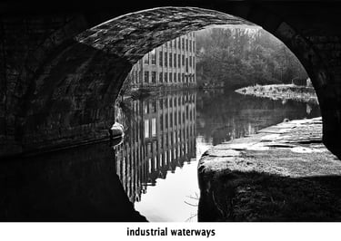 a bridge over the leeds and liverpool canal in black and white
