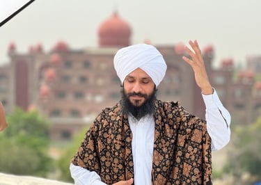 a man in a turban and a woman in a white shirt