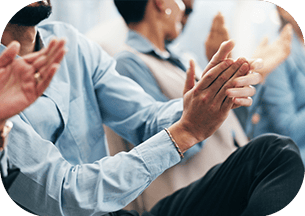 A diverse group of business professionals clapping