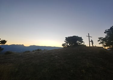 Holding a wooden cross near Chapelle Saint-Maurice, Drôme, Rhône-Alpes, France