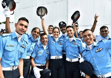 Air Force cadets in uniform, throwing their caps in the air, celebrating their graduation with joy and pride