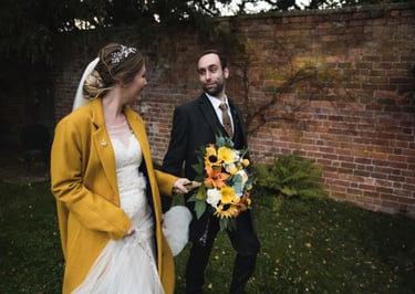 Bride and Groom holding hands and walking together