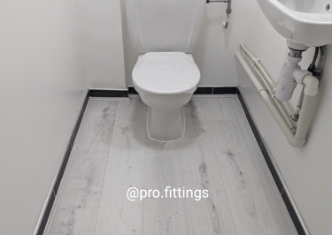 Laminate flooring fitted in a toilet in Poplar, London. 