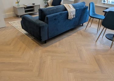 Herringbone flooring in a living room. Flooring fitted in Wandsworth. 