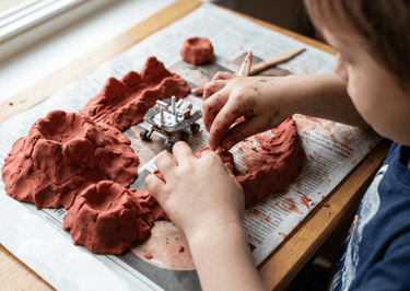 child making planet Mars mountains with playdough