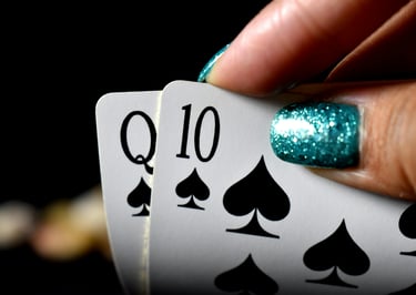 Winning Blackjack hand with blue shiny fingernails