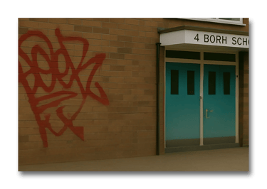 Graffiti removal from brick wall using laser surface cleaning technology