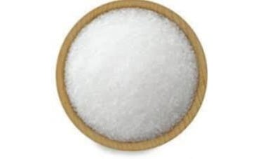 Hand-carved pink salt tealight holder creating a soothing, ambient candlelight effect