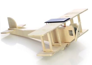 Wooden biplane model equipped with a functional motorized spinning electronic propeller.