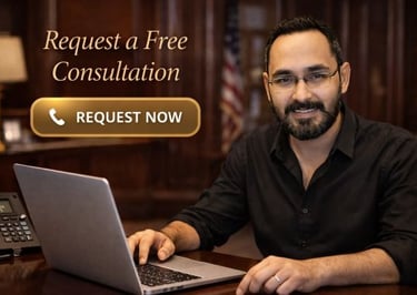 a man sitting at a desk with a laptop computer
