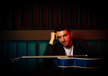 a man with a guitar and a guitar