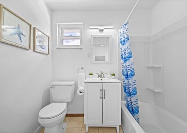 This family-friendly vacation home boasts a spacious backyard with outdoor seating and kids swings; 