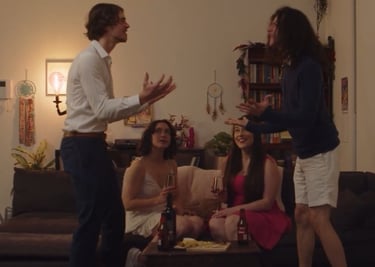 a man and woman standing in a living room