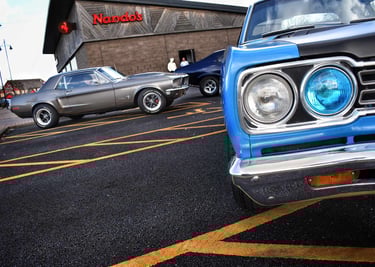 Classic American muscle cars Plymouth RoadRunner and Ford Mustang in Hull