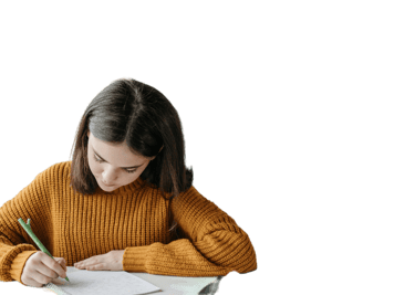 a woman in a yellow sweater is writing