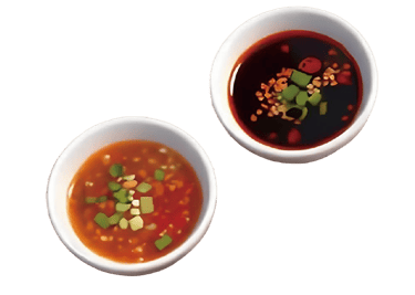 Assorted colorful dipping sauces in small bowls, including chili oil, sesame, and herbs, for a hotpot meal.