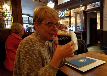 Lady Michelle enjoys a pint at Buckingham Arms Pub in London, England