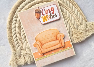 Handmade fall greeting card with a sofa and "Cozy Wishes" sentiment on it.