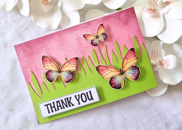 Bright and vivid handamde card with butterflies and "Thank you" sentiment