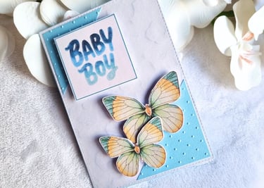 Handmade new baby card with butterflies. Blue colors.
