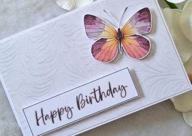 Simple handmade greeting card with colorful butterfly and "Happy Birthday" sentiment
