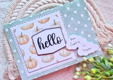 Handamde greeting card with dots, pumpkins and "Hello" sentiment on a beige background. Crafty vibe.