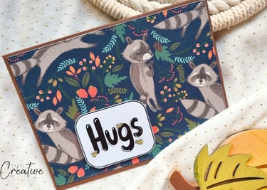 Fall themed handmade card with racoons and "Hugs" sentiment. Card making vibe.