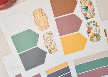 Colorful craft paper sheets featuring hexagonal shapes in muted tones and cutouts for card making
