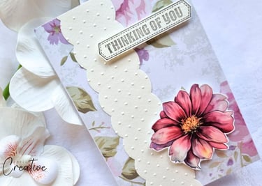 handmade greeting card with floral background, a pink flower and sentiment "Thinking of You"