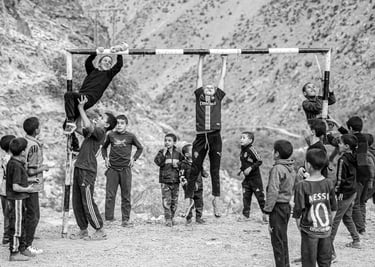 A powerful black and white image showing that the love for football transcends bysaid mrigua photographer