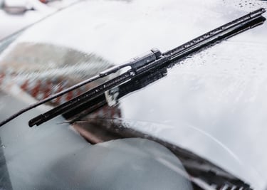 a car with a windshield and windshield wiper working