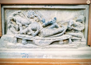 Intricate sculpture of Lord Vishnu resting on serpent Sheshnaga, attended by Goddess Lakshmi. 