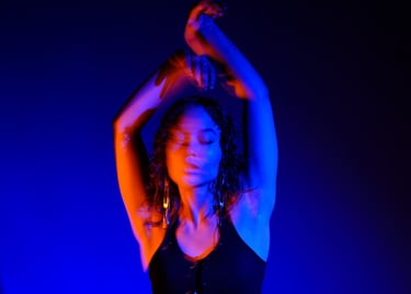 Red and blue gels used in studio. Motion blur, low exposure, female model. 