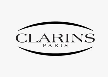 Logo of CLARINS, a global beauty brand whose standards are met by King Fly.
