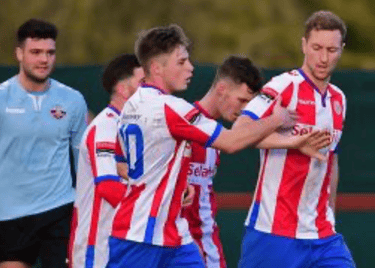 Robb Sheridan, semi professional footballer, celebrating with teammates during a match.