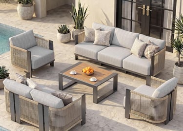Modern outdoor sectional sofa set with grey cushions and rope detailing on a luxury poolside patio.