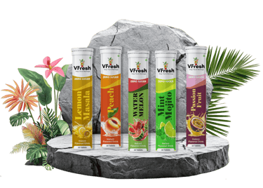 VFresh sugar-free effervescent drink tablets in fruit flavors like peach and mint mojito on stone.