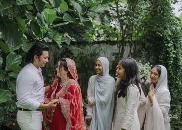 a man and woman in white and red indian wedding attire