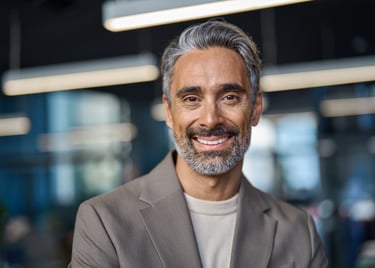 a man with a beard and a beard, smiling