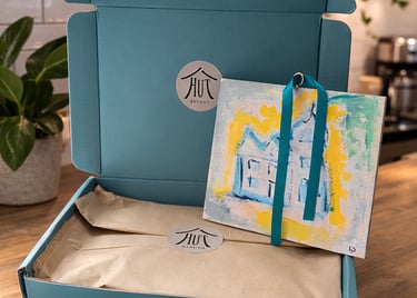 Small original art being un boxed from Hut Studio luxury eco packaging, new home, birthday gift