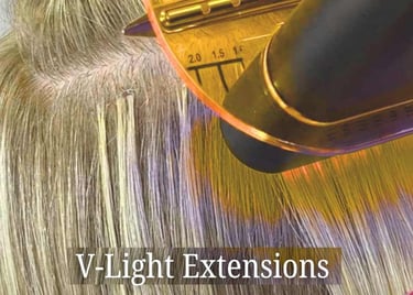Professional application of V-Light hair extensions using a specialized UV bonding tool on blonde hair.