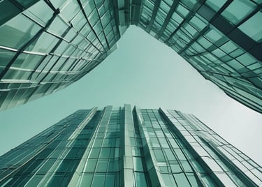 Close-up of modern glass buildings with intricate architectural lines against a cloudy London sky.
