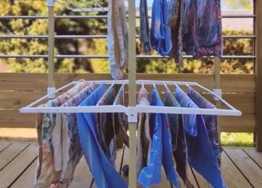 a clothes rack with clothes hanging on it