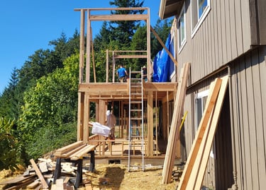 2-story addition on a house being framed.