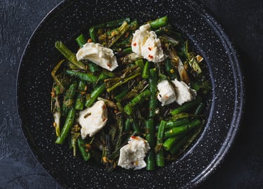 A plate of grilled scallion, green bean and mozzarella salad. Recipe by Dan Clapson