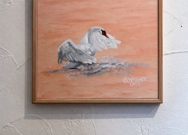 Swan oil painting in floating frame on textured wall