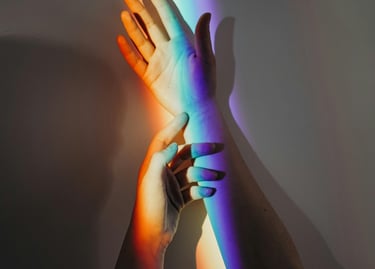 Different colours of light reflected on a hand
