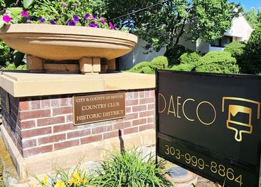 a fountain fountain with a fountain in front of a brick building
