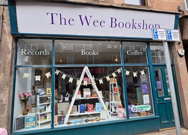 a store front window of a book store on Kempock Street in Gourock